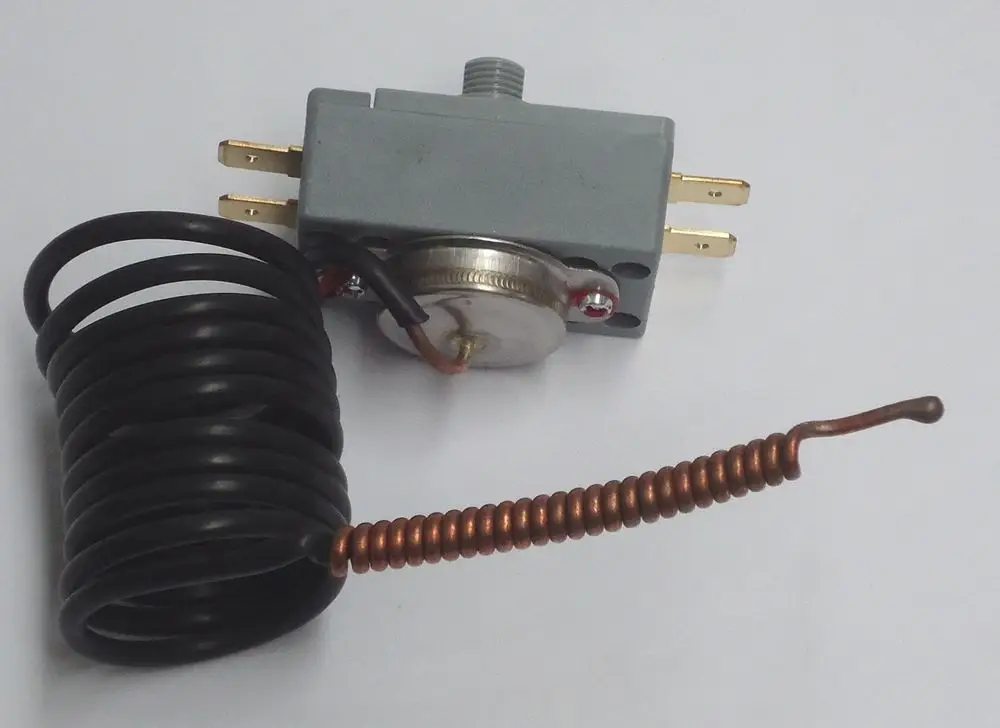 Thermostat von Daikin mit einem Metalldeckel, zwei elektrischen Anschlüssen und einer rotierenden Spirale, geeignet für das Regelungssystem.